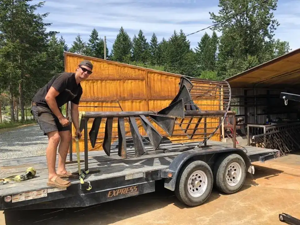 A finished gate leaving the shop on a trailer
